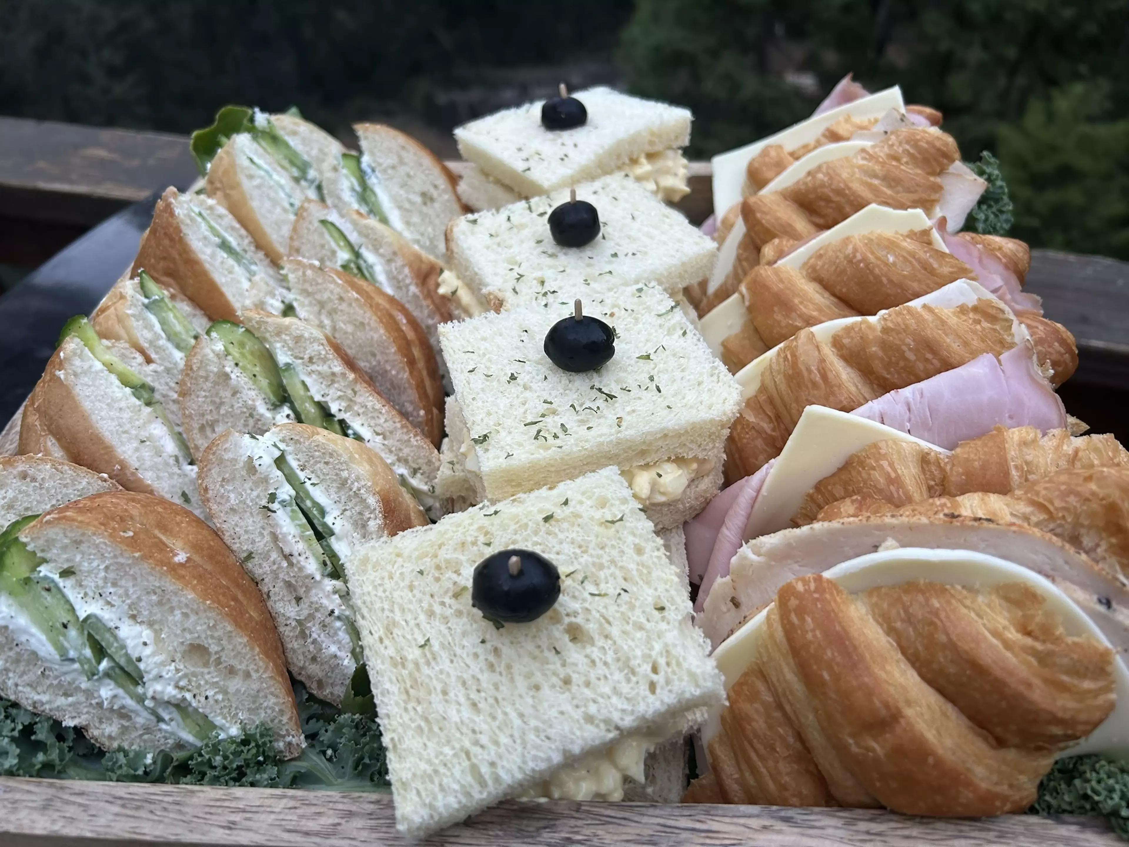 A box full of sandwiches catered by Bean Catering.