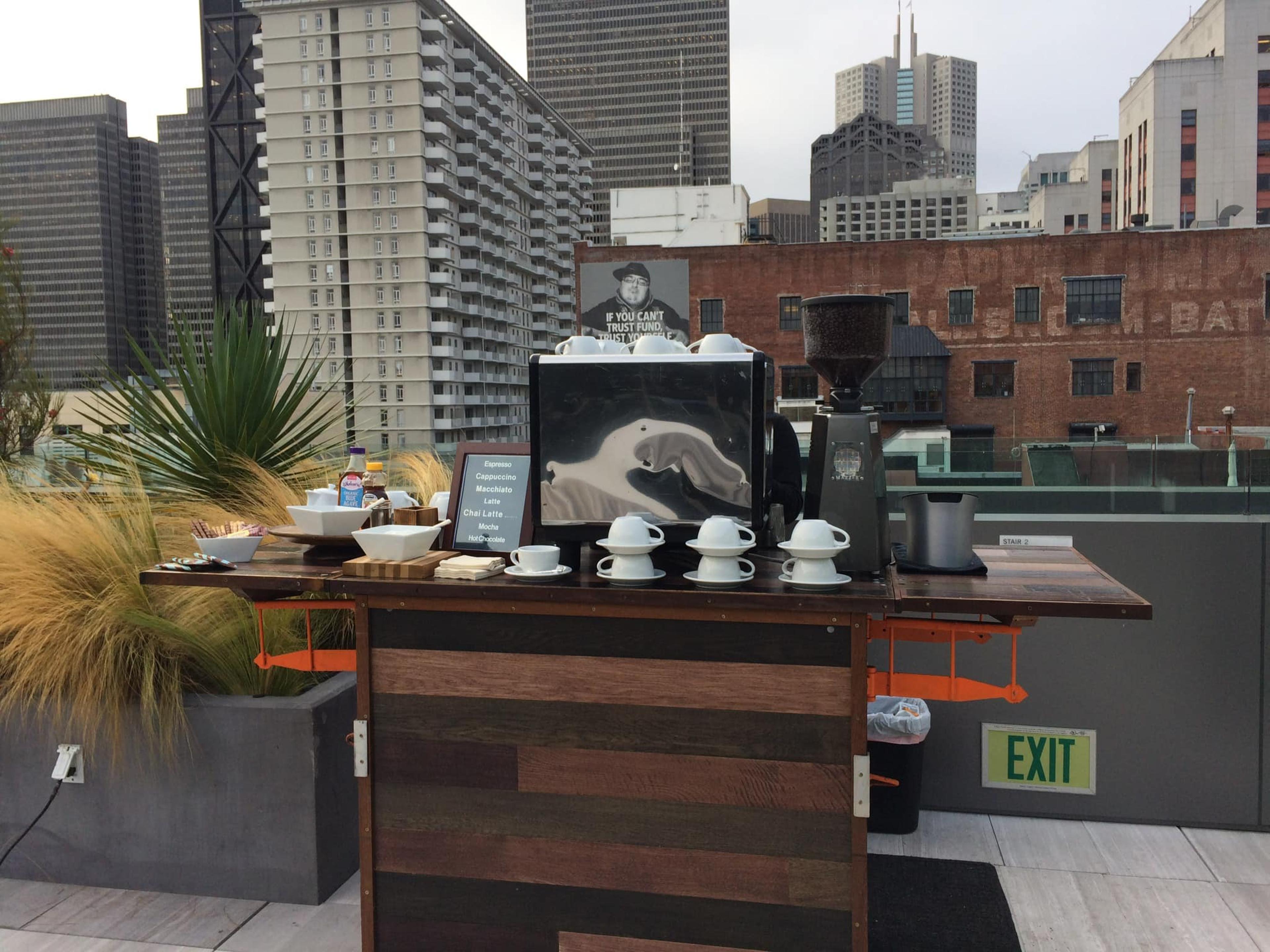 The Bean Catering mobile espresso bar set up in front of a city skyline.