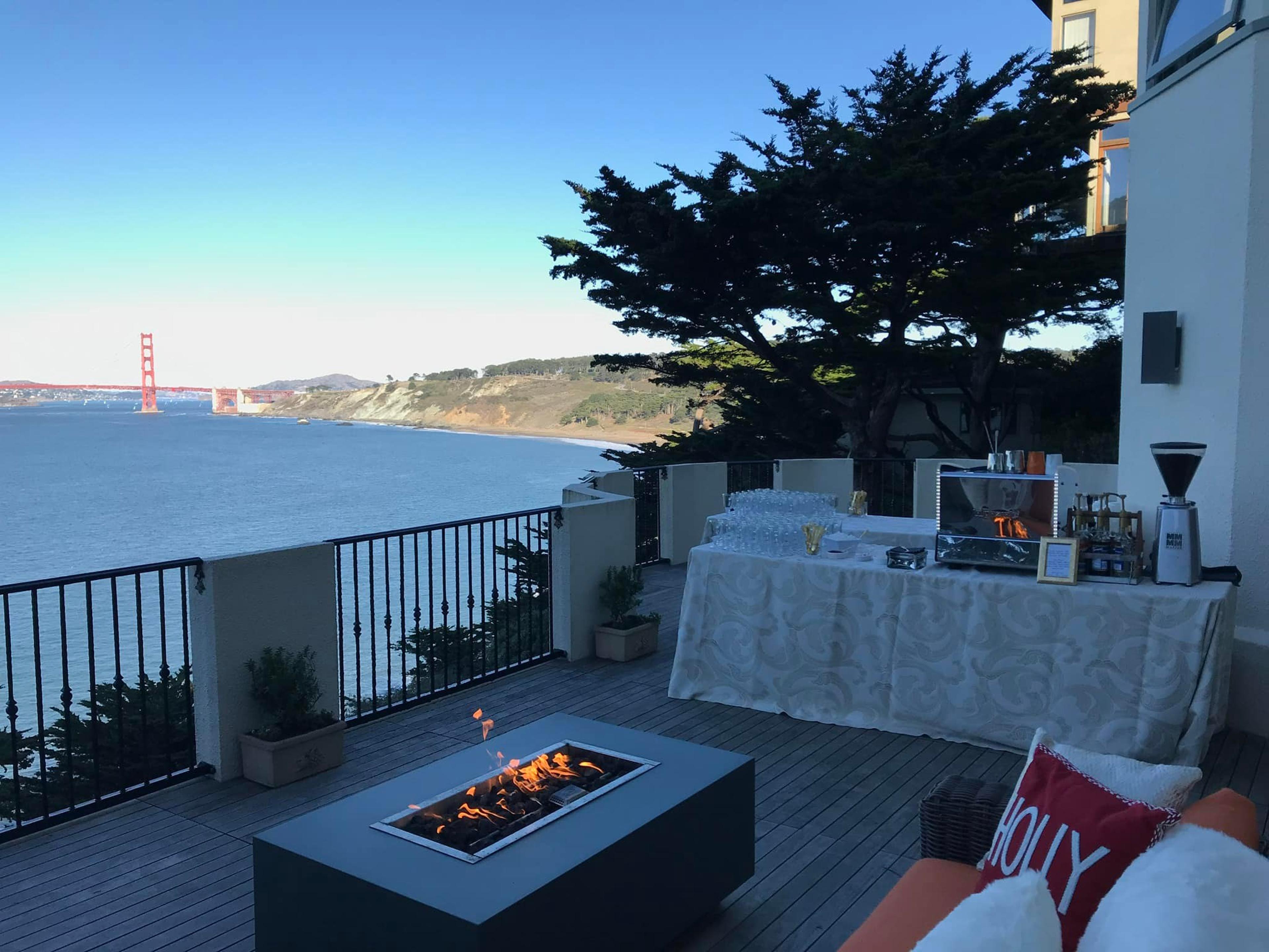 The Bean Catering mobile espresso bar set up at an event with the Golden Gate bridge visible in the background.