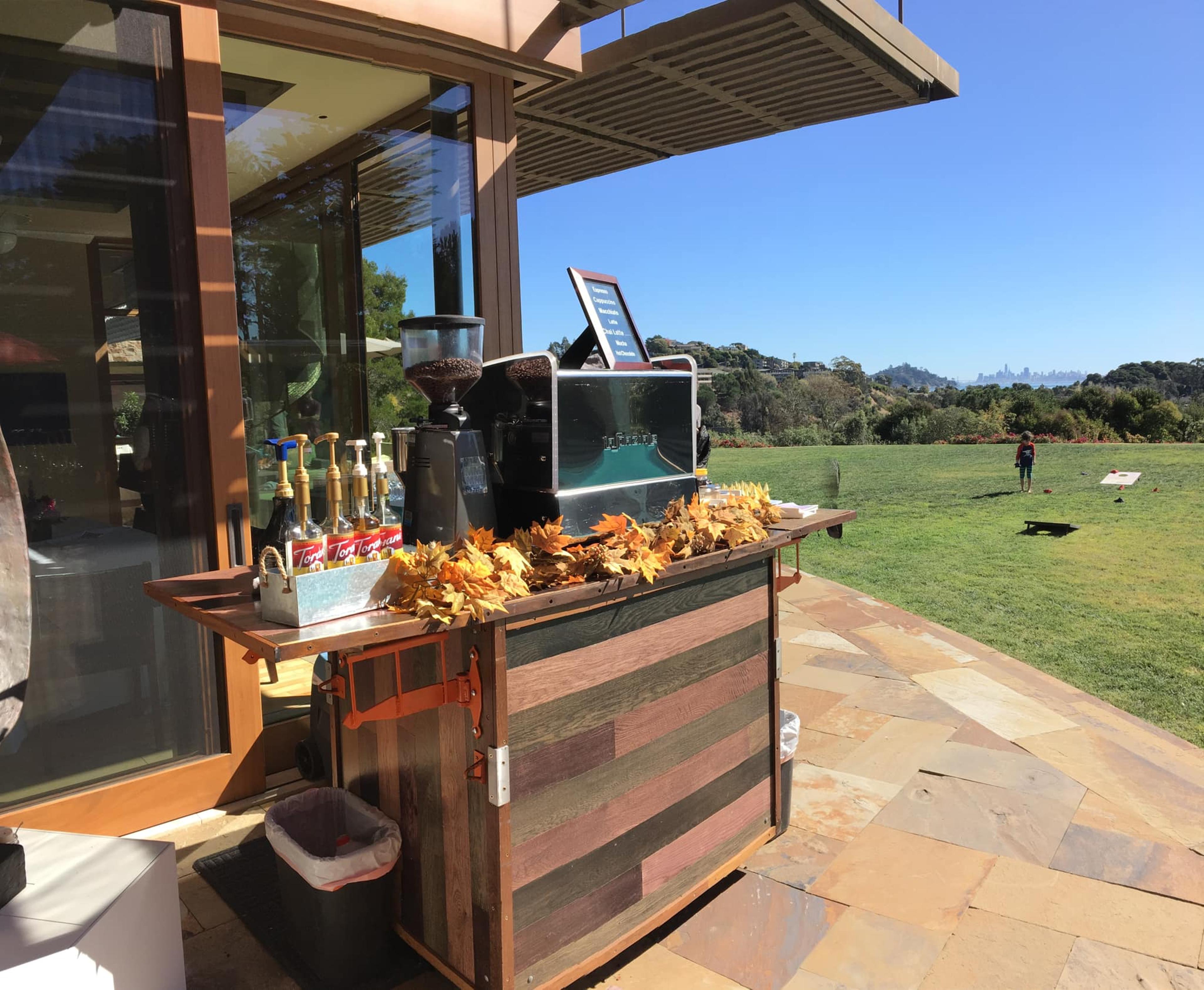 The Bean Catering mobile espresso bar set up in front of field.