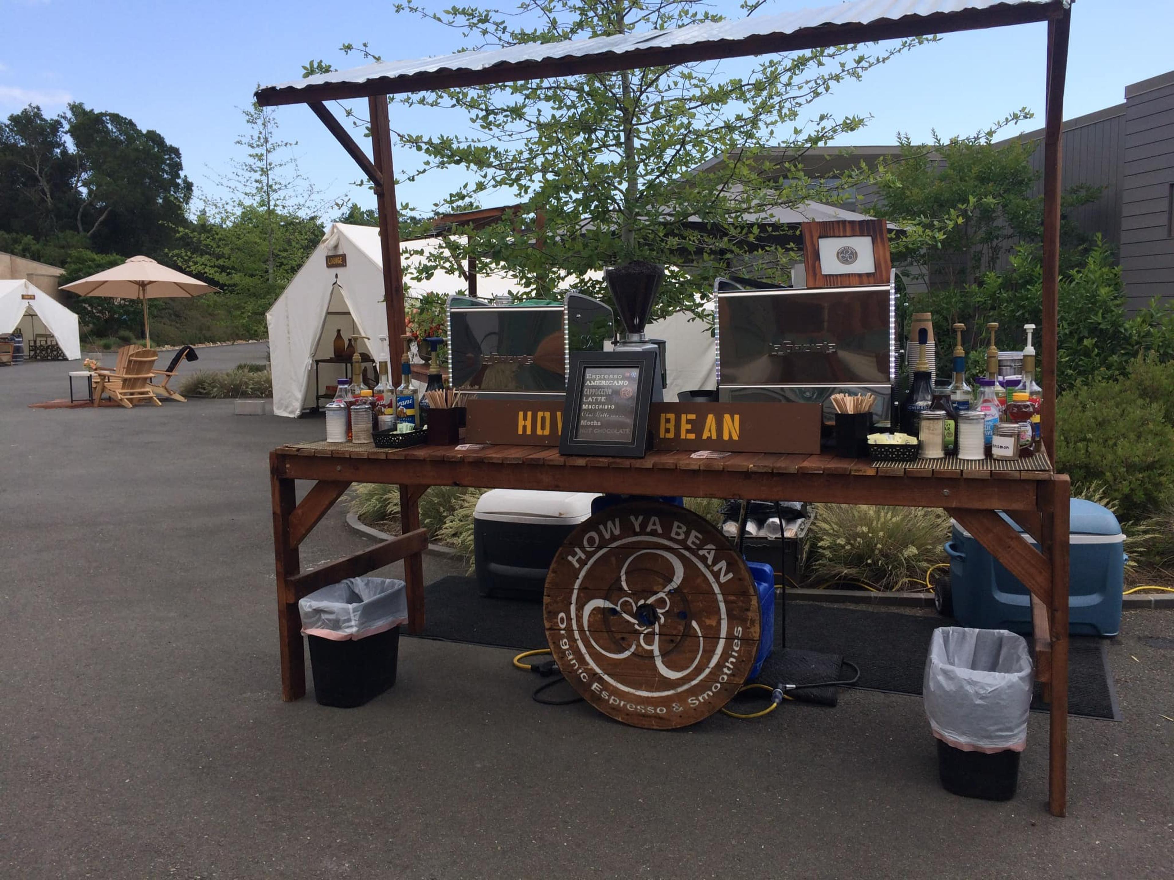 The Bean Catering mobile espresso bar set up on a rustic  booth.